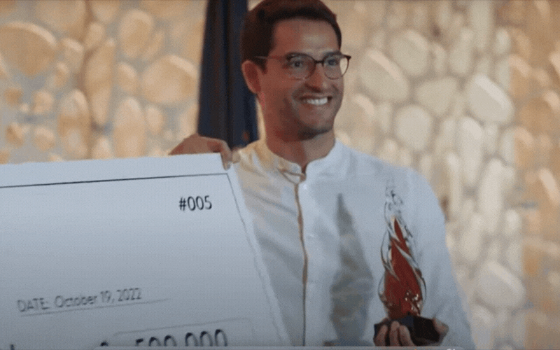 Motion image of CEO, Federico Acosta, and large check.